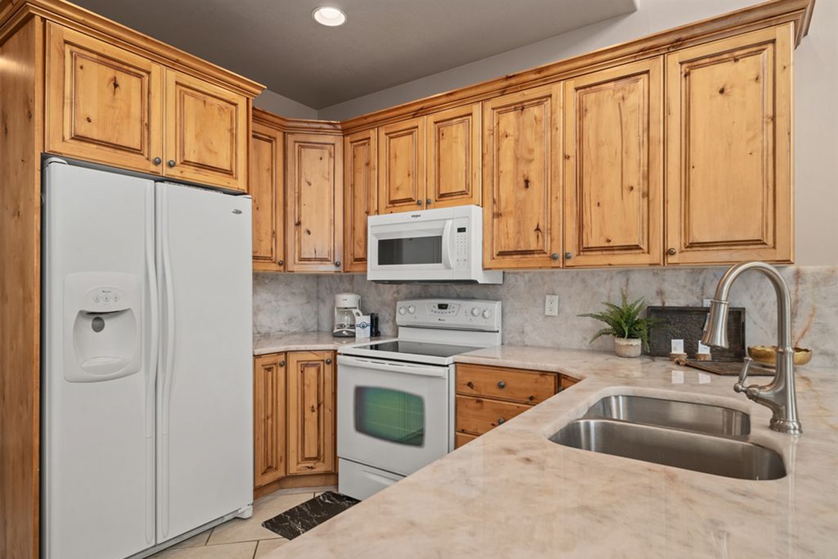 Fully stocked open kitchen, spacious counters—perfect for cooking and entertaining.