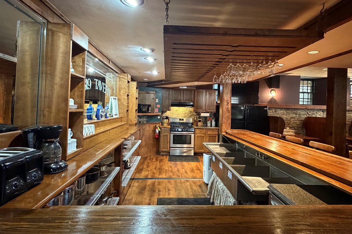 Tavern bar & kitchen view upon entry from upstairs.
