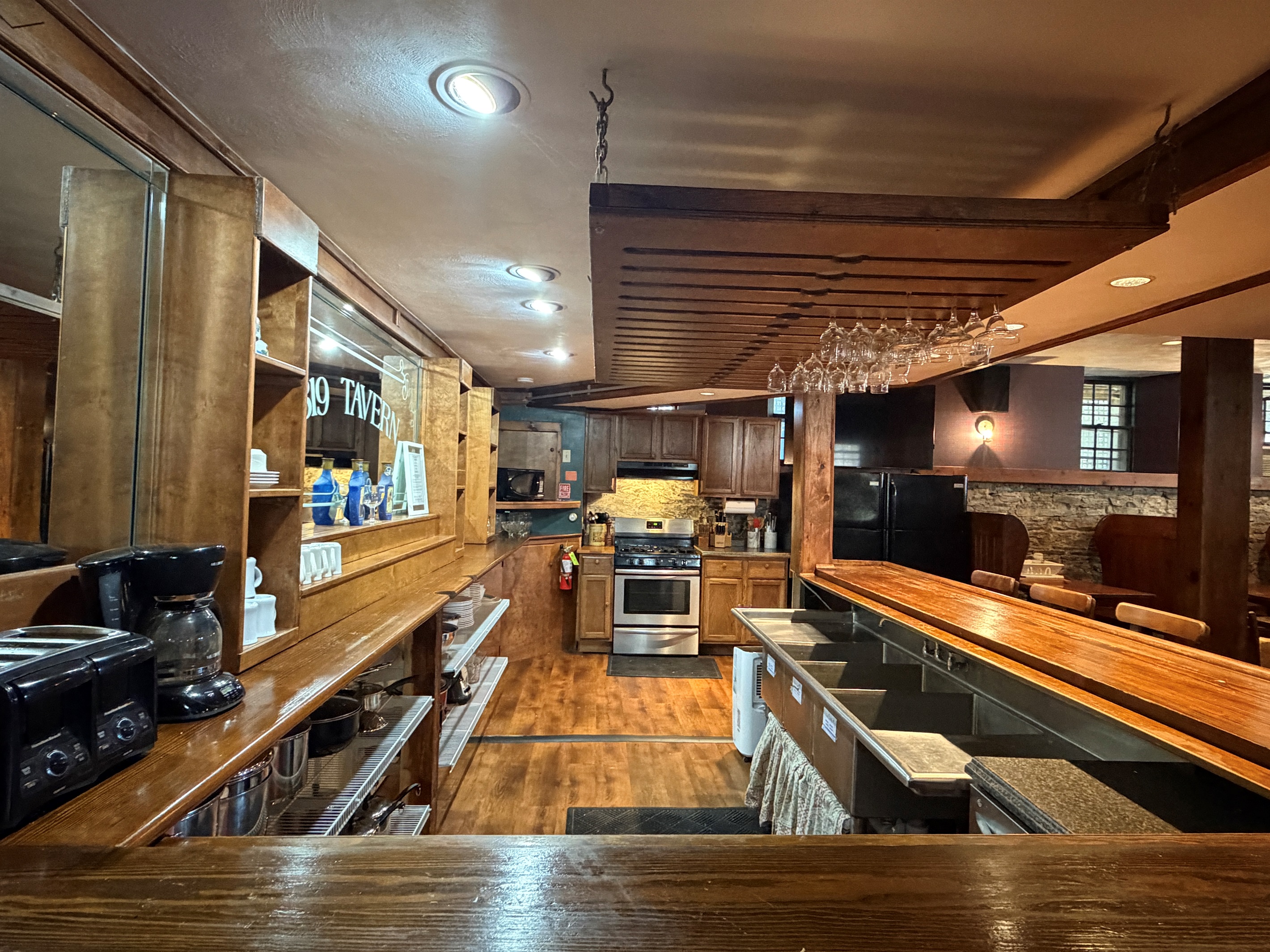 Tavern bar & kitchen view upon entry from upstairs.