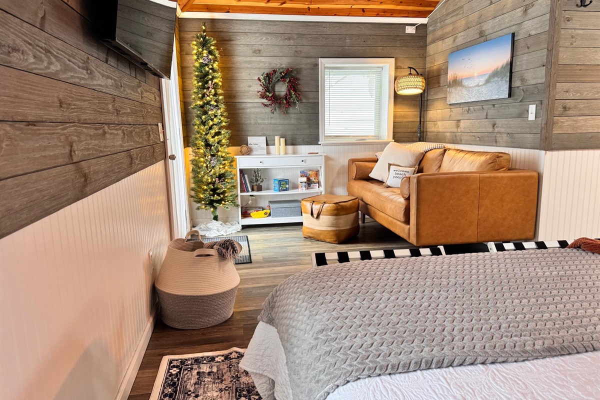 Curl up on the modern leather sofa and enjoy the soft glow of the holiday lights