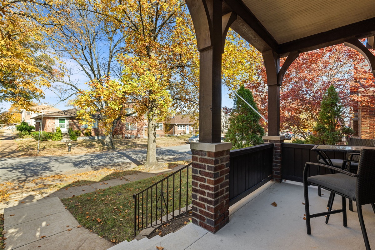 Enjoy sitting on the porch and taking in the views of the nice tree-lined street.