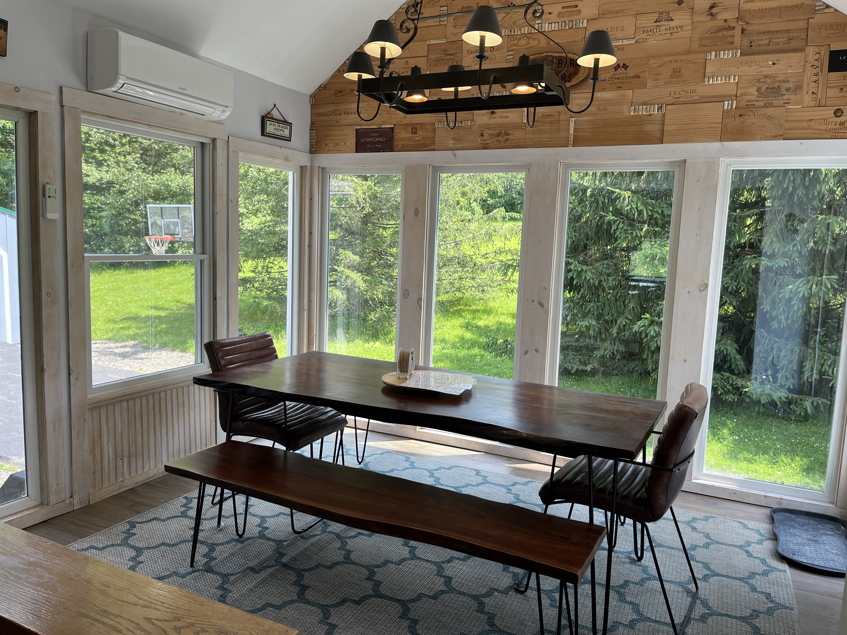 Dining room with lots of natural light and tall ceilings.