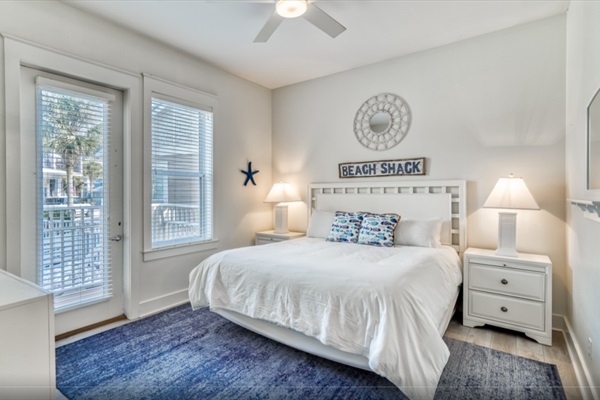 Primary Bedroom - 1st floor King Bed with private pool access &         en-suite bathroom