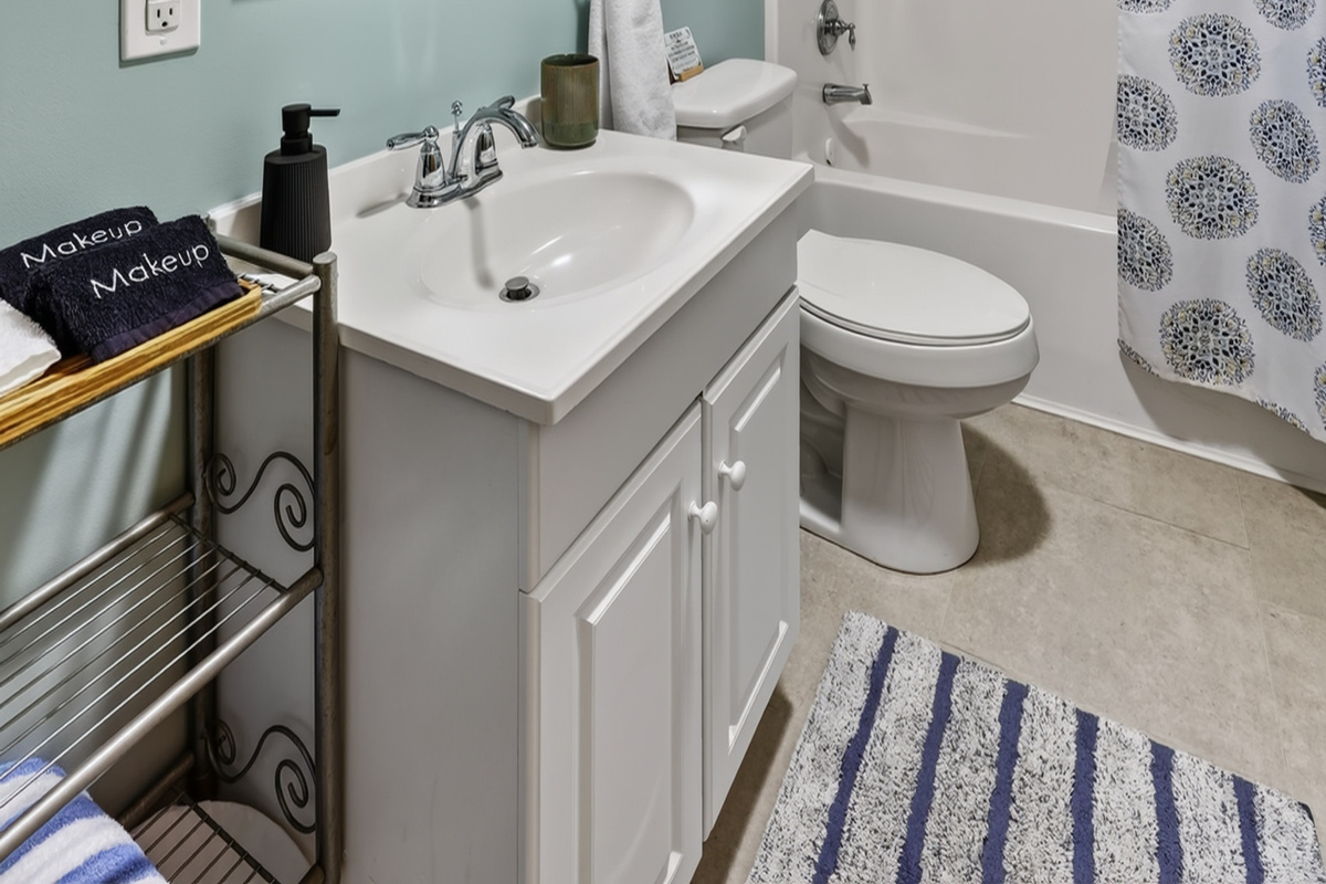 The main bathroom features a combo shower/tub with rain head and removable sprayer. We provide towels, linens, as well as basic soaps and essentials.
