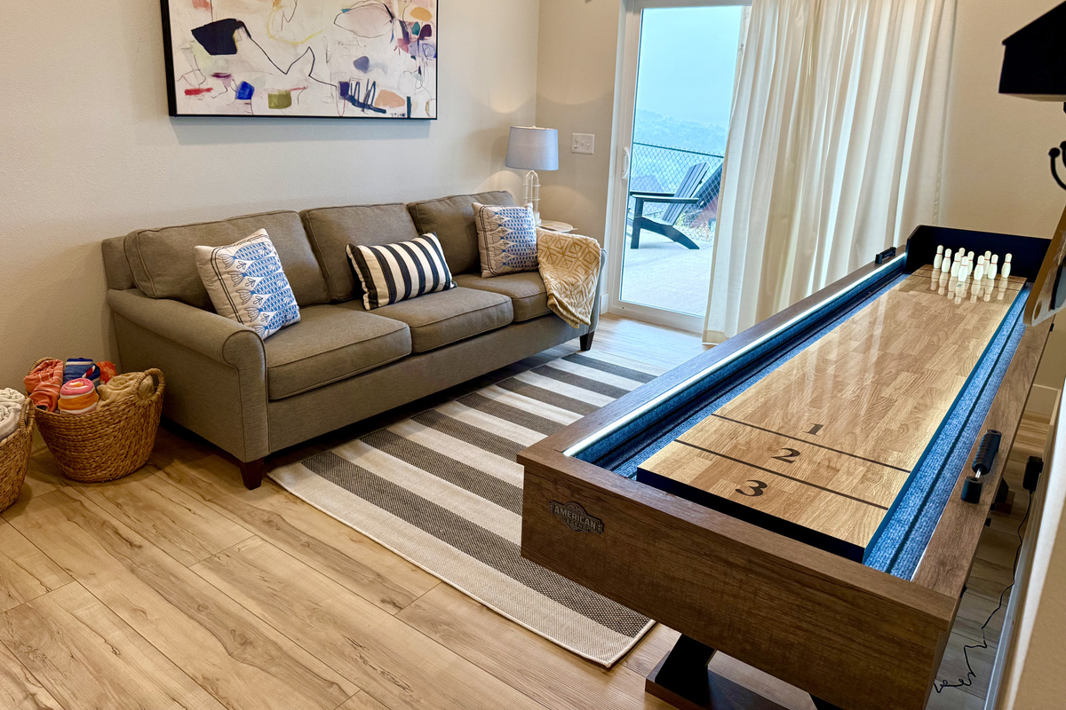 Living area with pull-out and shuffleboard