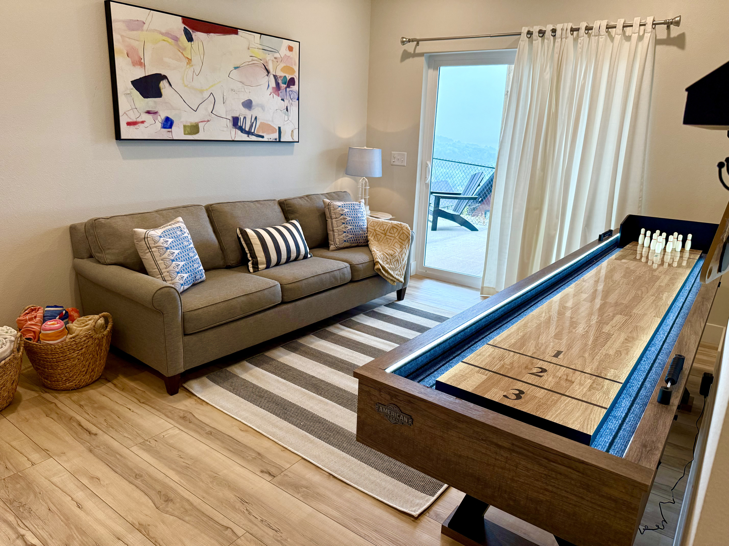 Living area with pull-out and shuffleboard