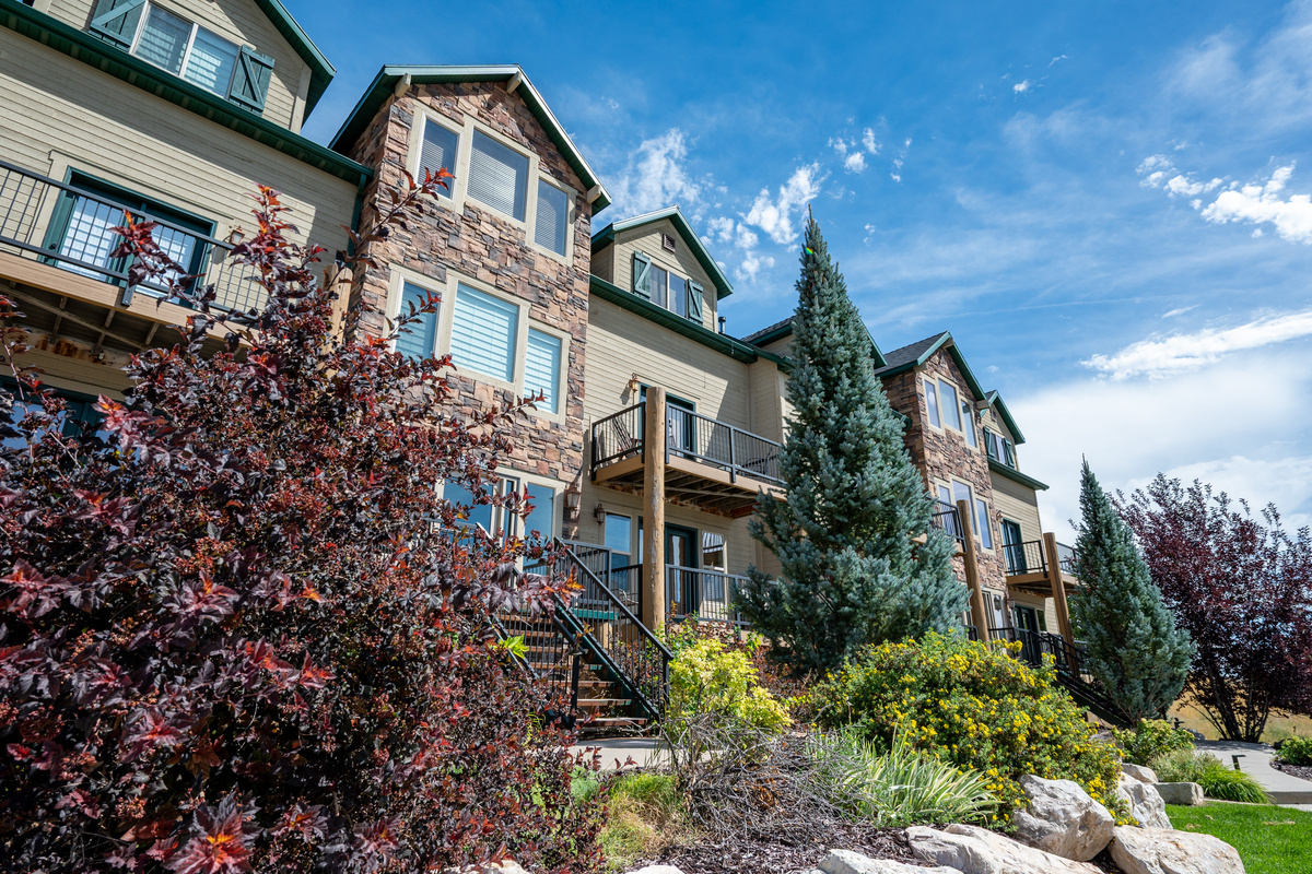 Stone and wood-inspired exterior details give the property timeless mountain character.