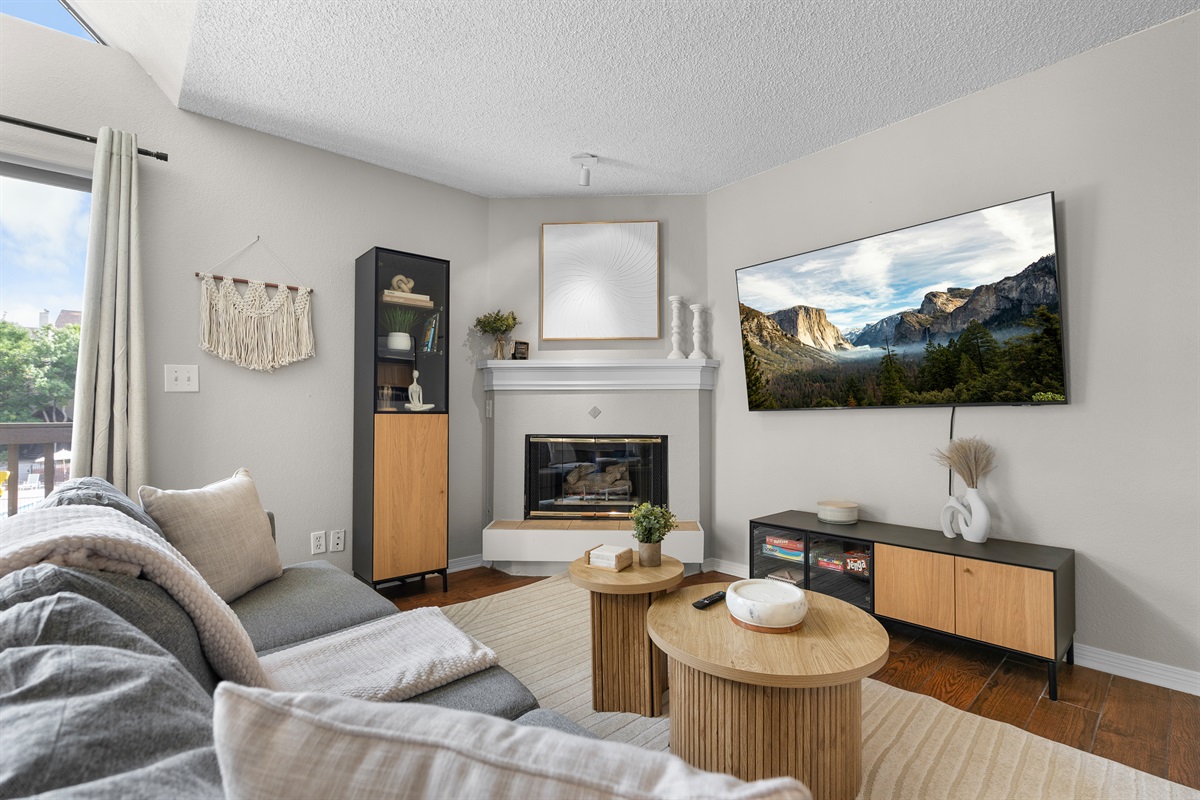 Warm and inviting living space, with lots of natural light and open floor plan to kitchen.