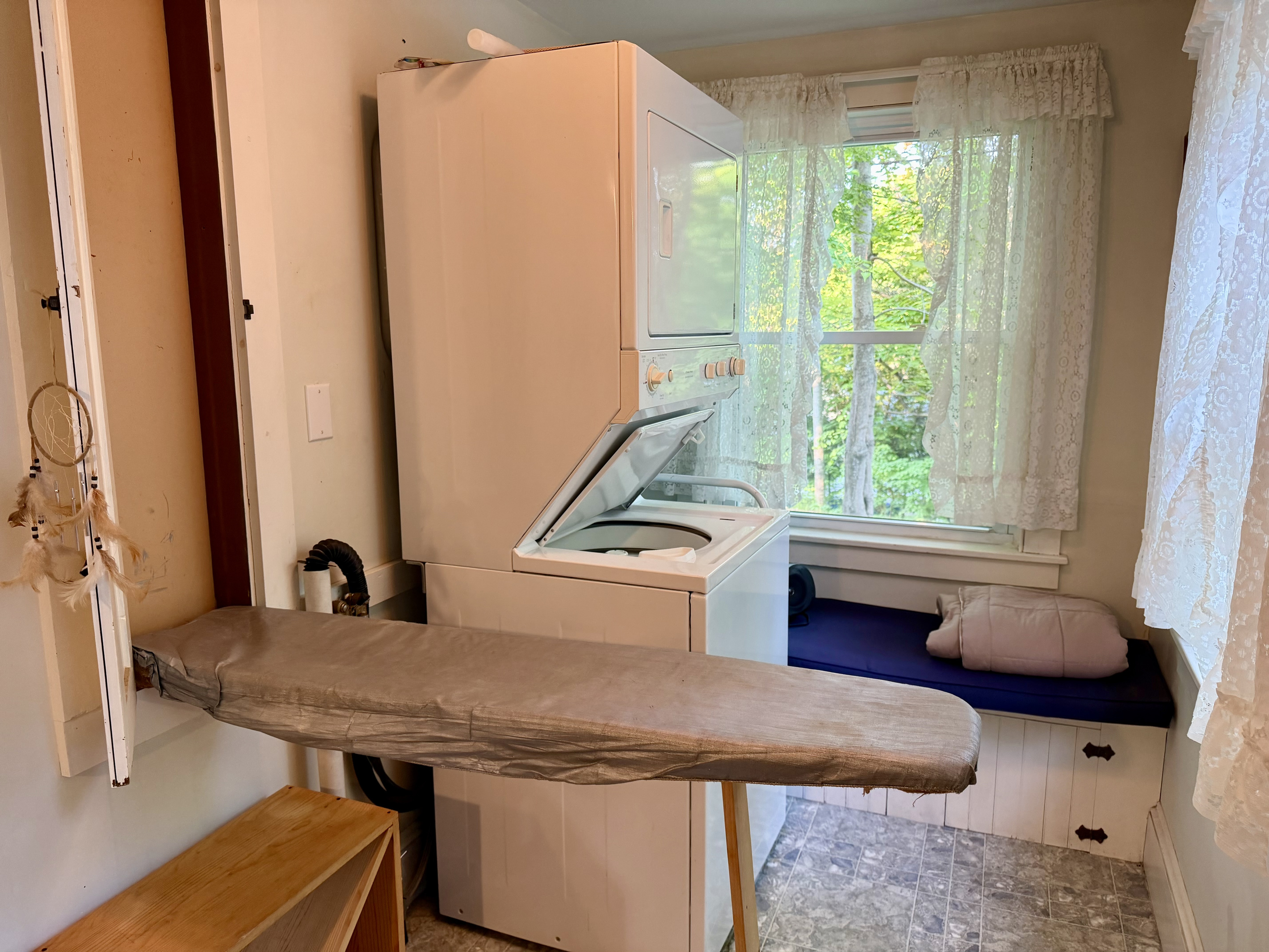 Clean clothes made easy. The laundry nook features a stacked washer and dryer alongside a clever, custom built-in fold-down ironing board. A highly functional amenity designed to keep your wardrobe fresh during longer stays on MDI.