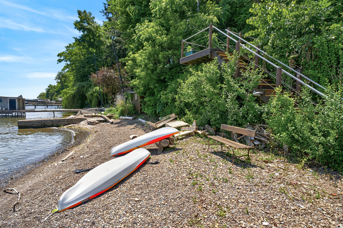 Two kayaks beside the water