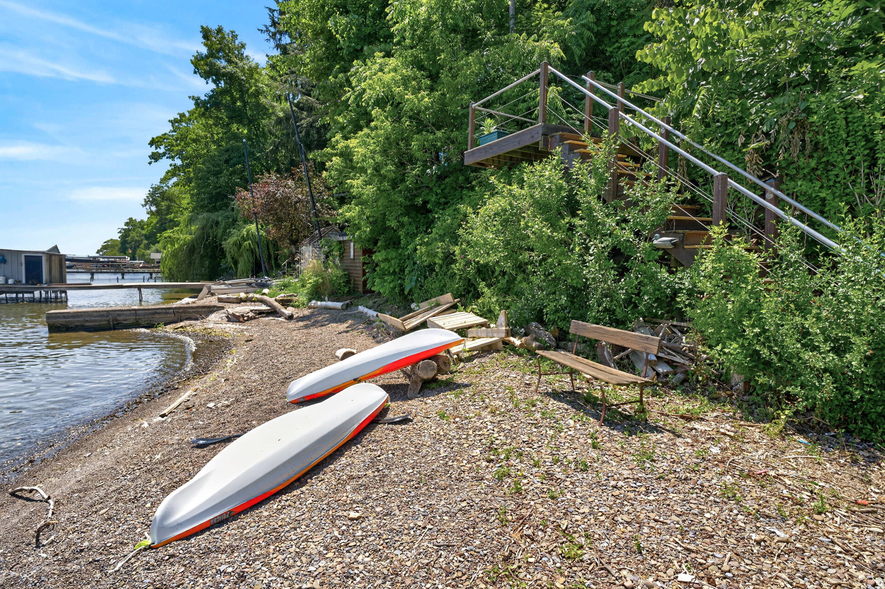 Two kayaks beside the water