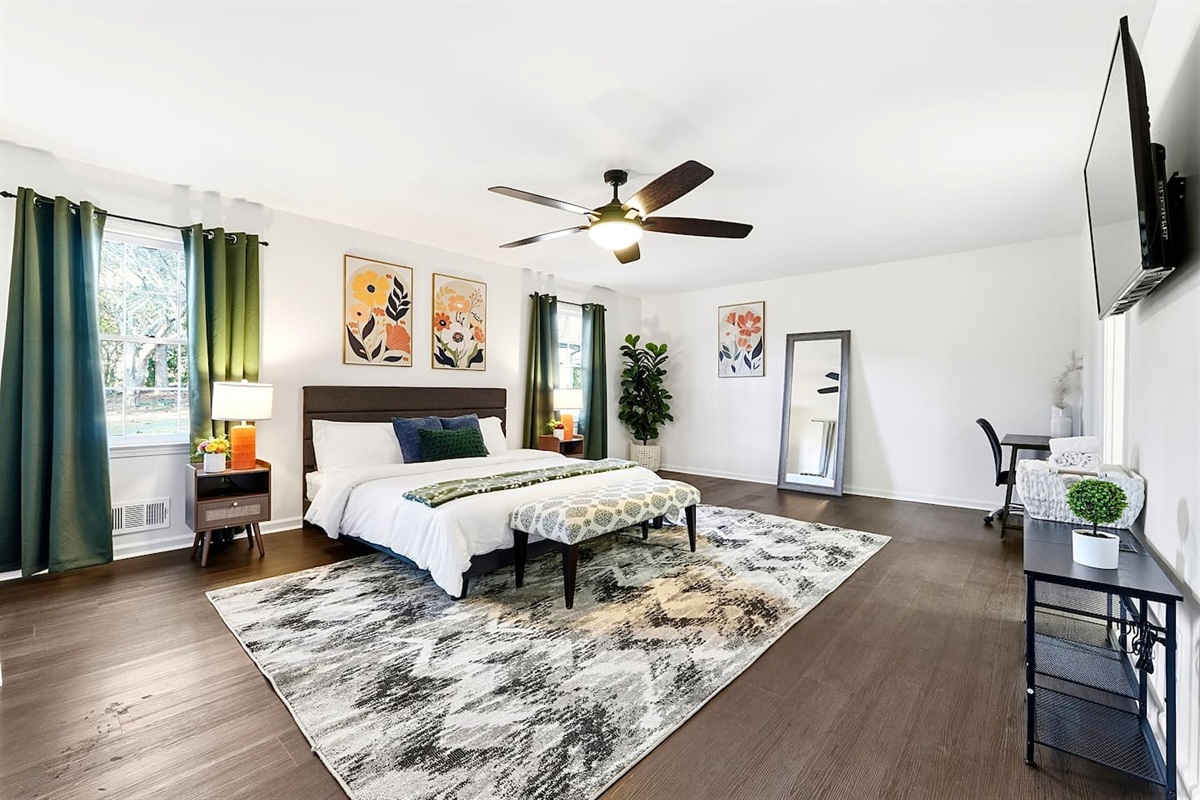 Spacious first-floor master bedroom located to the far right as you enter through the front door. This earthy, calming retreat features a king bed and smart TV. This room includes 2 full-body towels, 2 washcloths, and 2 hand towels for your stay.