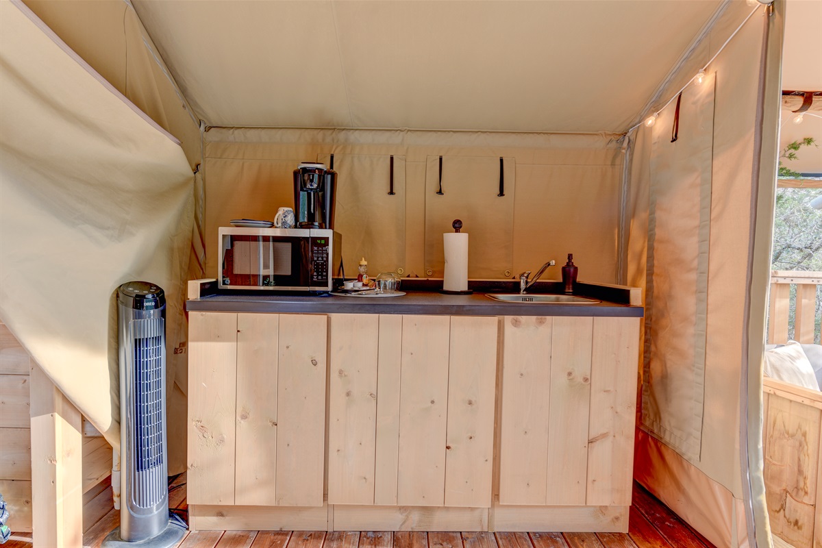 Microwave, mini-fridge, and another sink