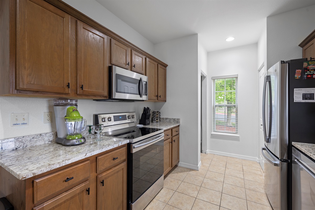 Modern stainless cooktop and microwave plus a margarita machine!