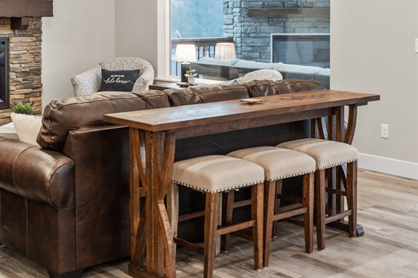 There is also a small table behind the couch that seats 3.