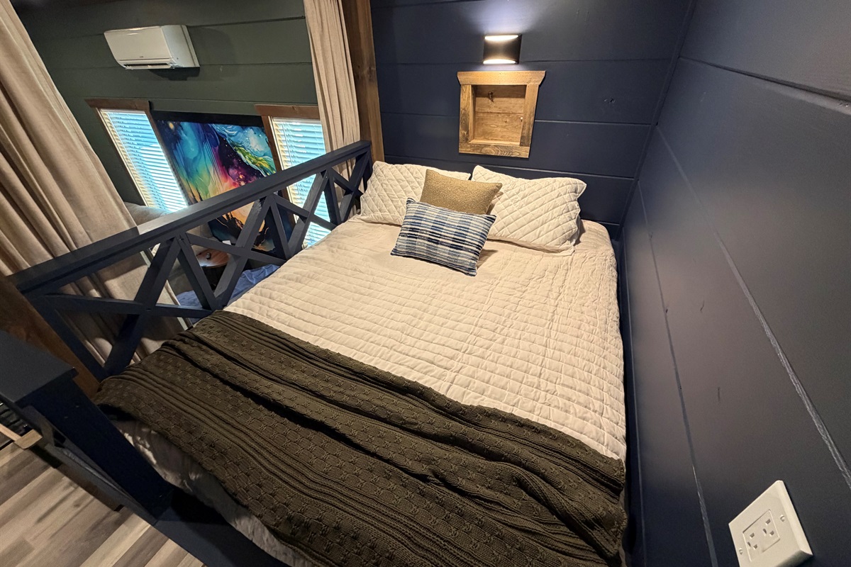 The built-in queen bunks have shelves with outlets for your phone, and switched lights
