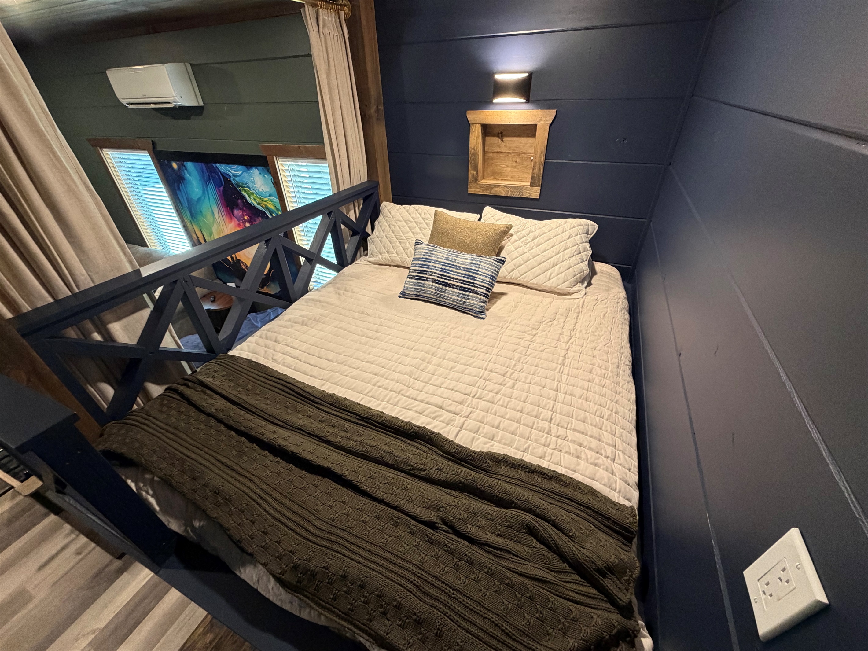 The built-in queen bunks have shelves with outlets for your phone, and switched lights