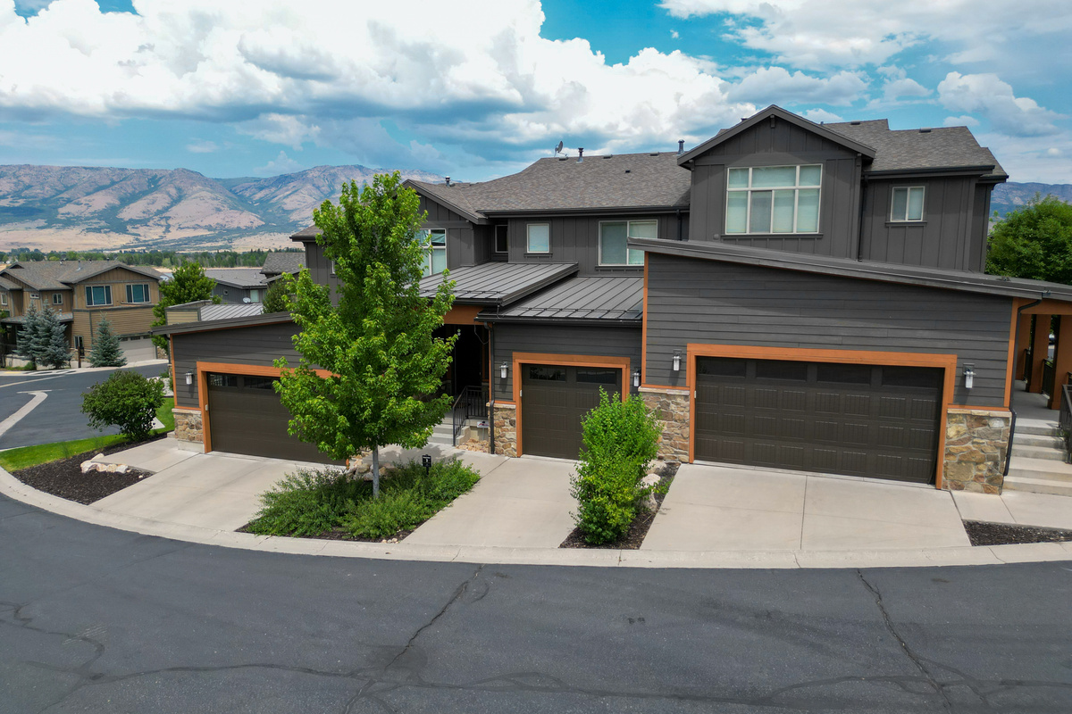 Modern mountain townhome in the Edgewater community with stunning curb appeal and a spacious one-car garage for your use.