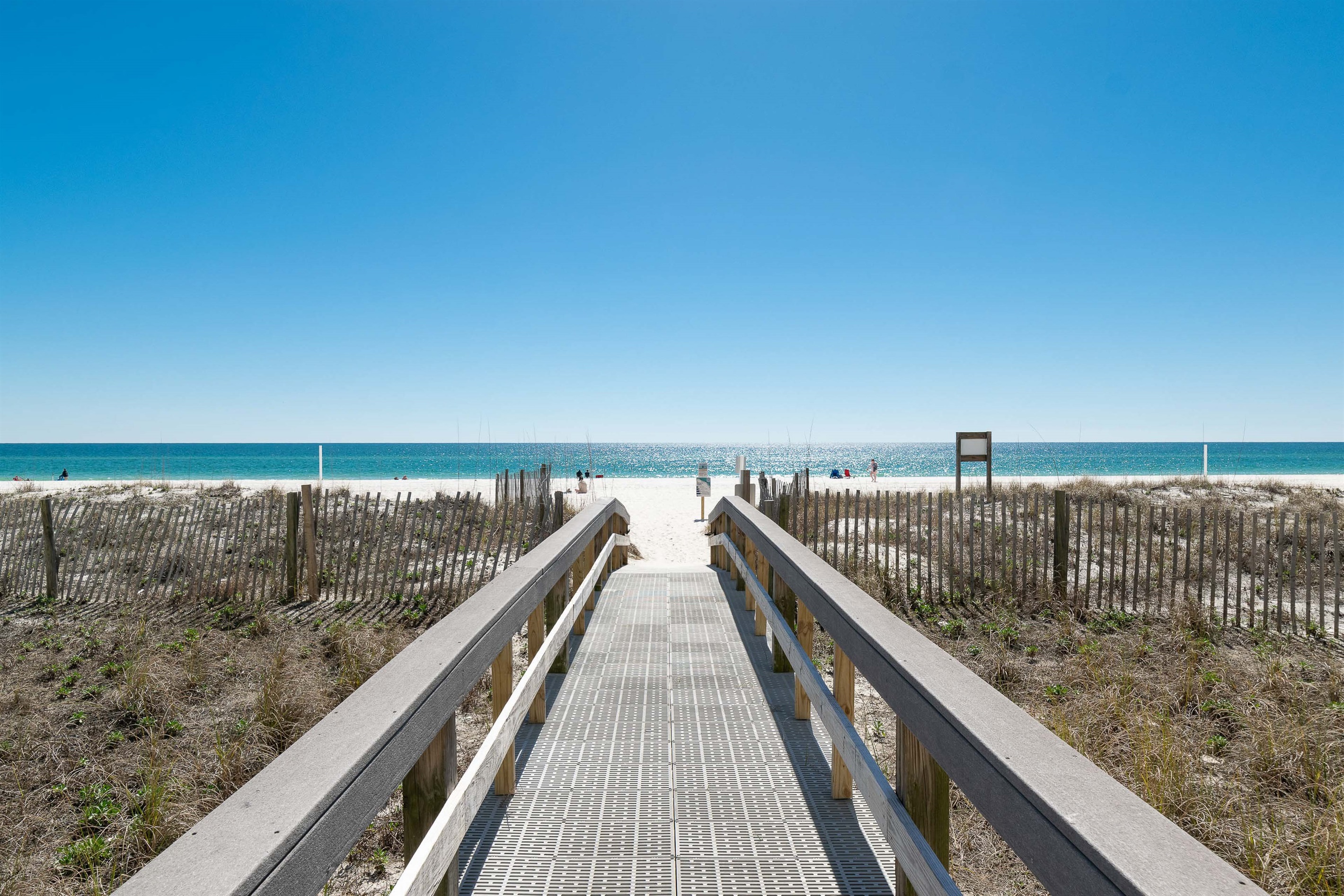Step directly from the Lighthouse Condominium onto the sugar-white sands of Gulf Shores. Your private beach escape is just a few steps away.
