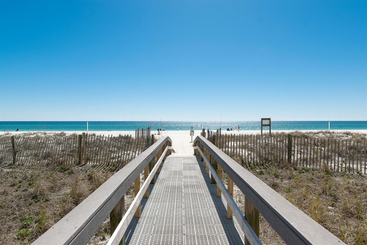 Step directly from the Lighthouse Condominium onto the sugar-white sands of Gulf Shores. Your private beach escape is just a few steps away.