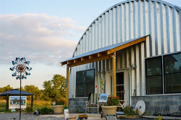 View of the front porch & parking area. 