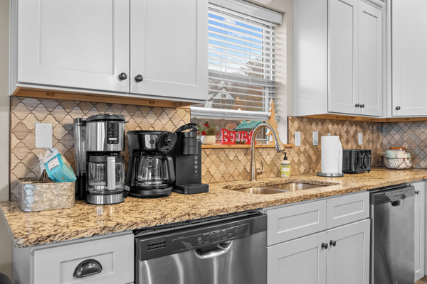 Main level kitchen. Two full-size refrigerators, two dishwashers, oven/ceramic glass cooktop, microwave, drip coffee maker, Keurig, and Nespresso. Stocked with small appliances, cookware, bakeware, utensils, dishes, glassware, mugs, and more!