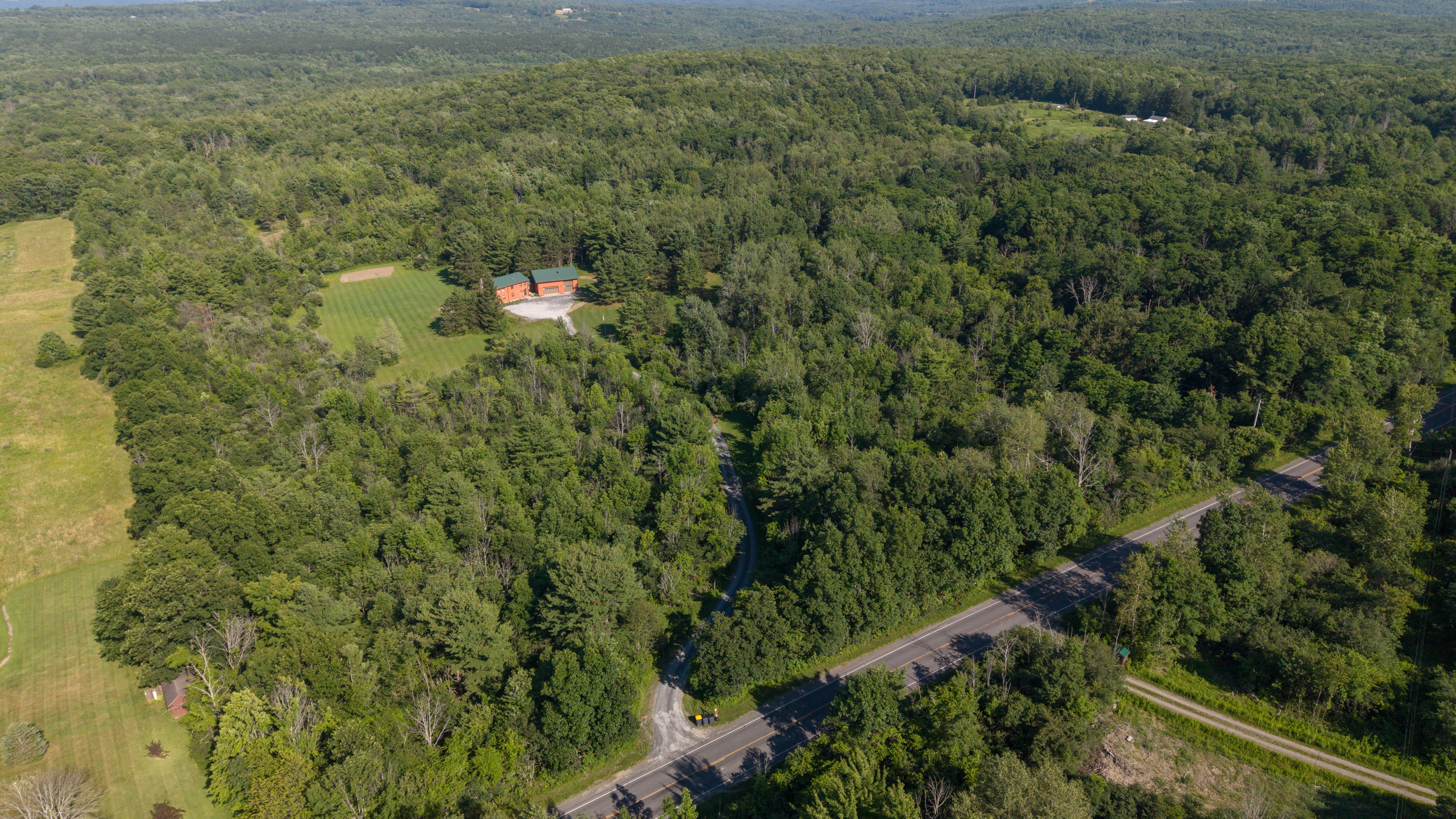 Aerial view of the wooded property