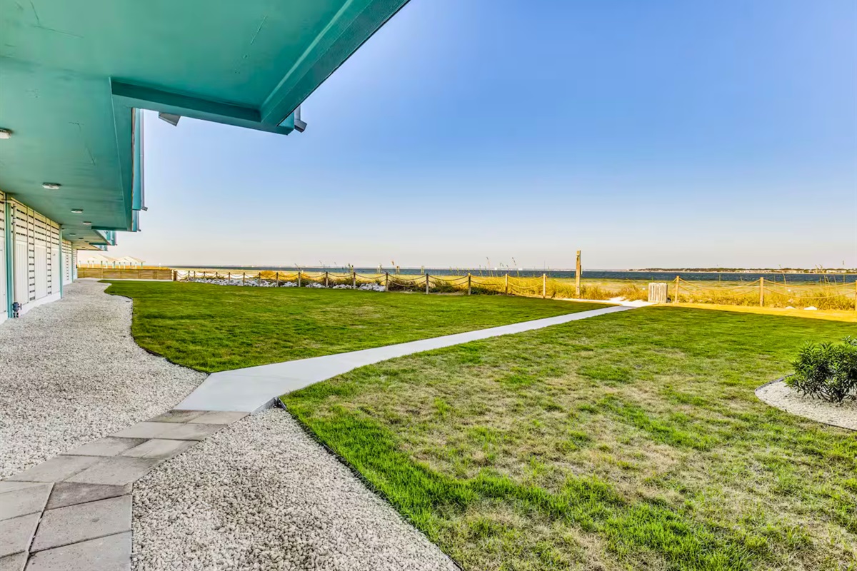 A shaded walkway offers a cool and convenient path just steps from the shoreline.