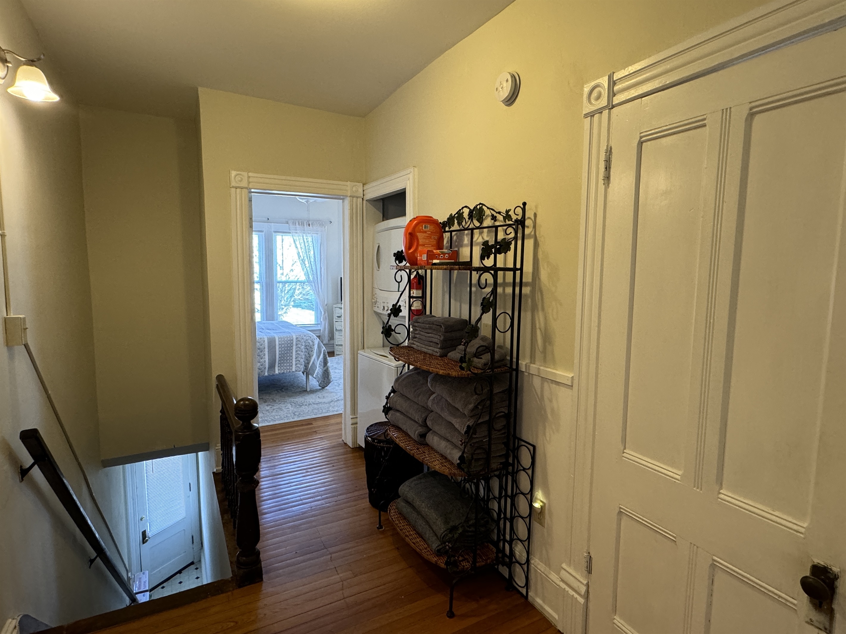 Hallway with laundry and Queen bedroom #2 beyond