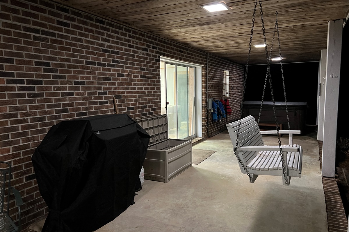 Swing, grill, or relax in the hot tub. Easy walkout access from the downstairs. Plenty of hooks for lifejackets to hang dry