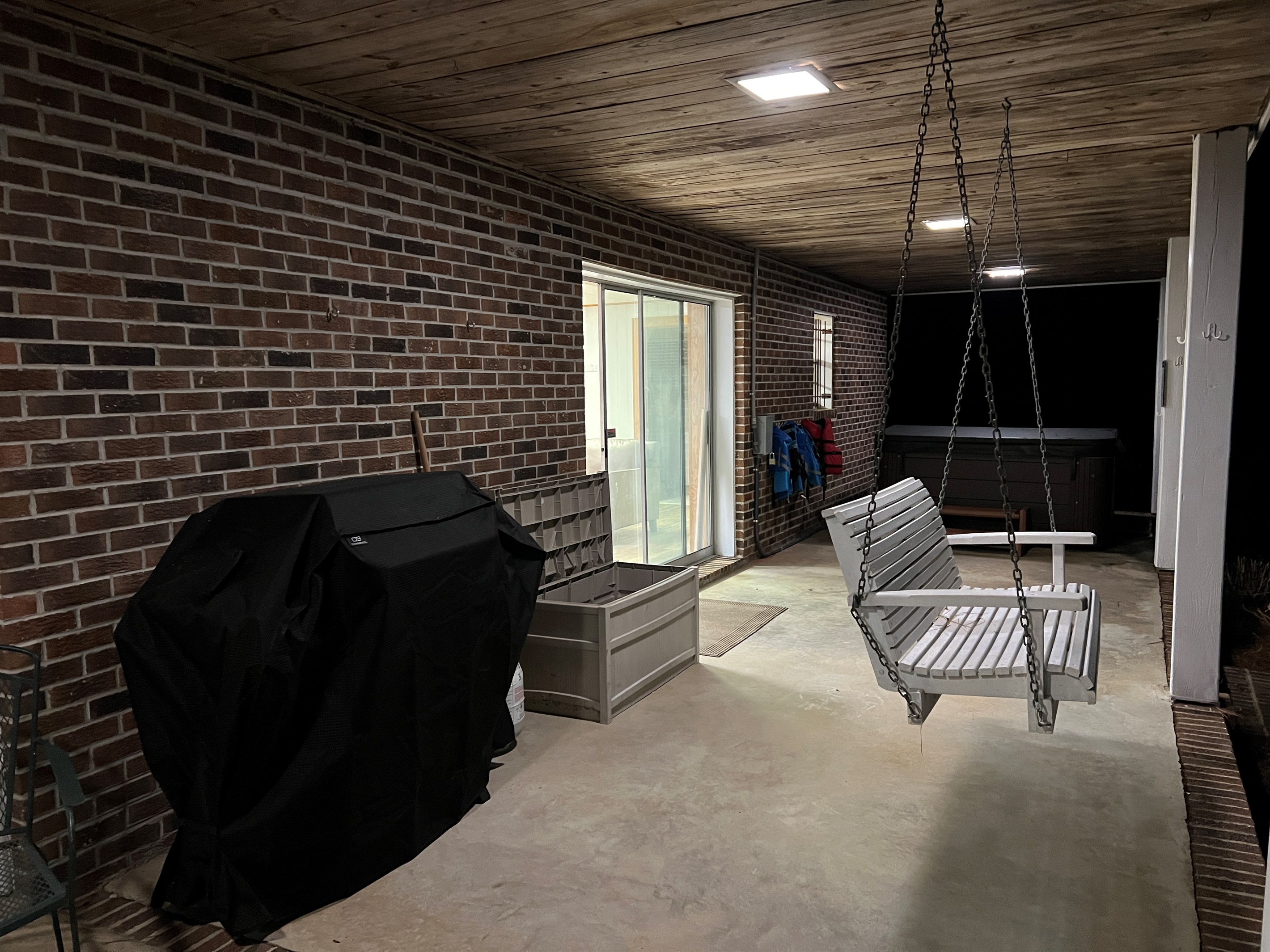 Swing, grill, or relax in the hot tub. Easy walkout access from the downstairs. Plenty of hooks for lifejackets to hang dry