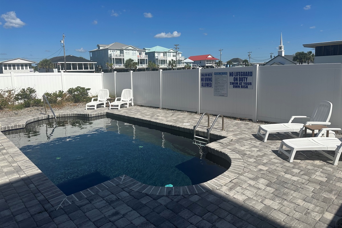Pool area with loungers