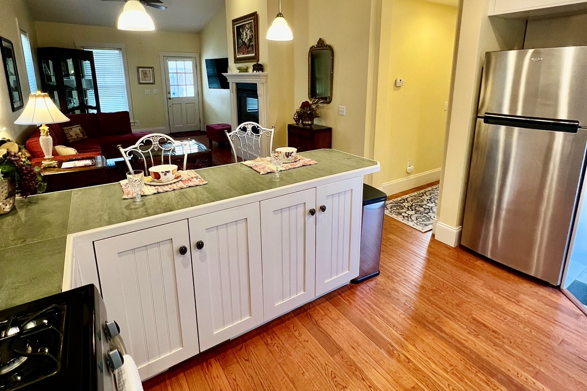 "Never miss a moment of the fun—prep dinner while staying connected with your guests in this seamless open-concept space."