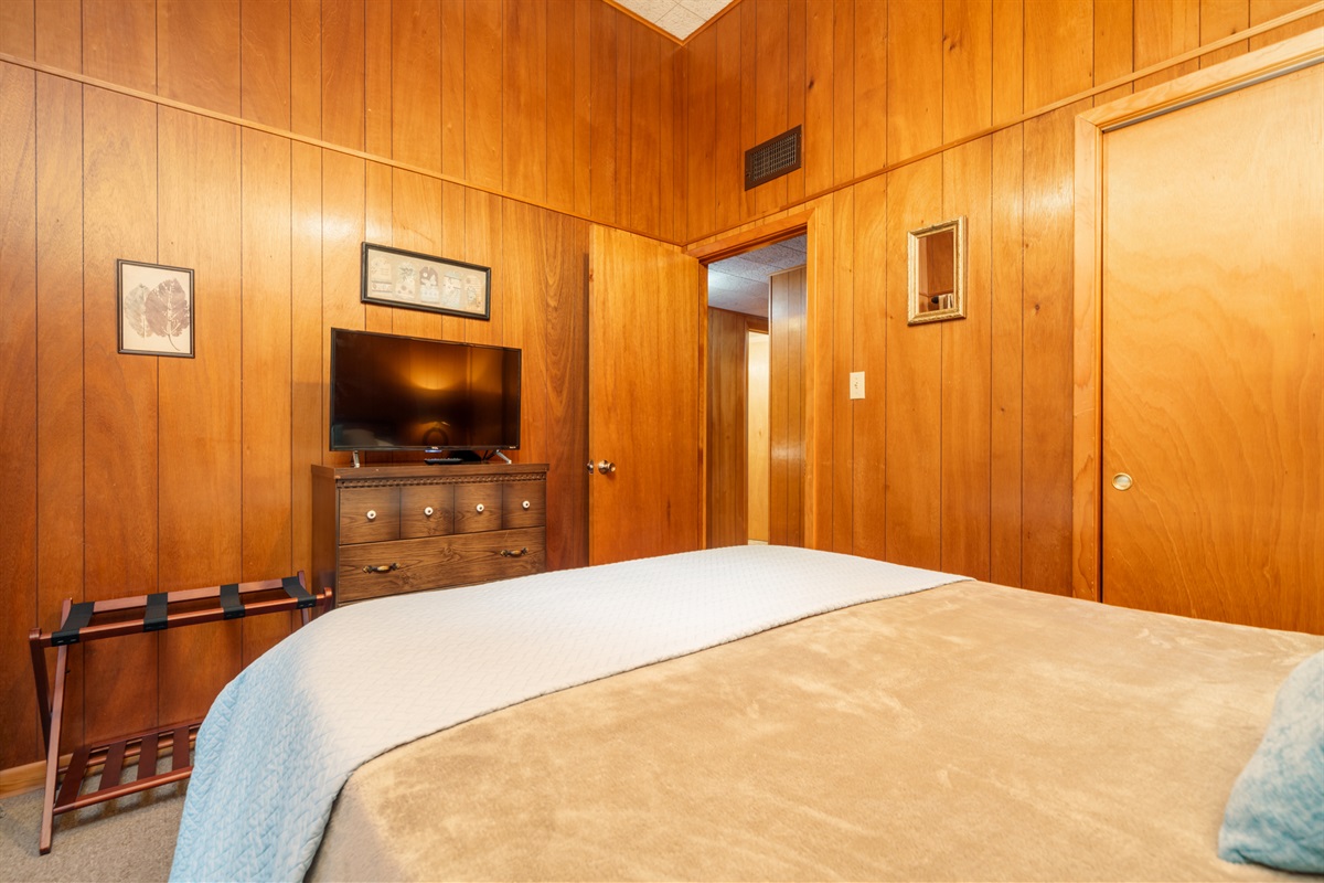 Both bedrooms feature streaming TVs, full-length mirrors, and vaulted ceilings.