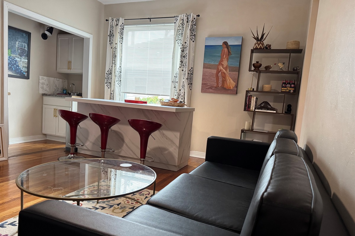 Living room and kitchen area are roomy with everything you need for a short or mid-term stay. 
