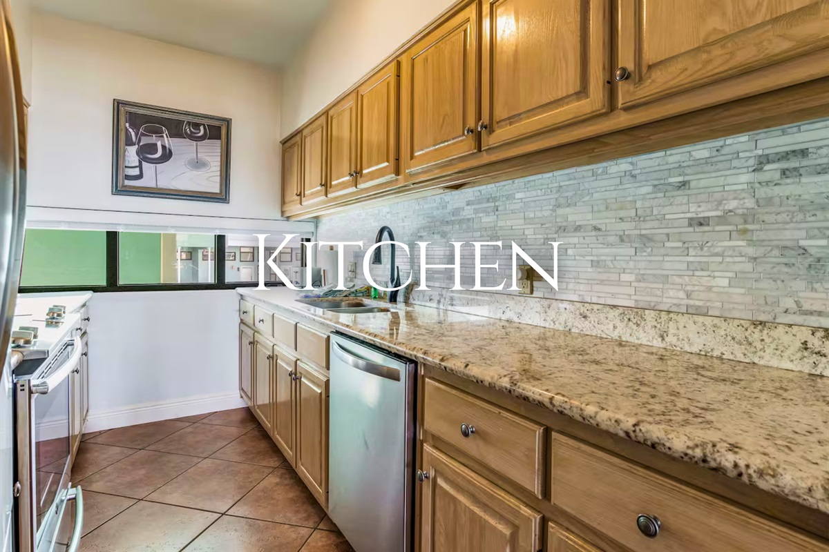 Step into a well-equipped kitchen with generous counter space for prepping meals with ease.