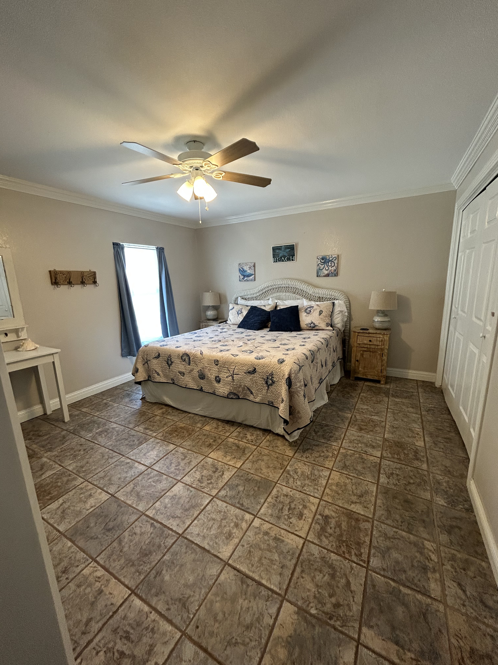 King Suite with ensuite bathroom and backyard/pool access (Ground-level) . Additional twin rollaway bed available. 