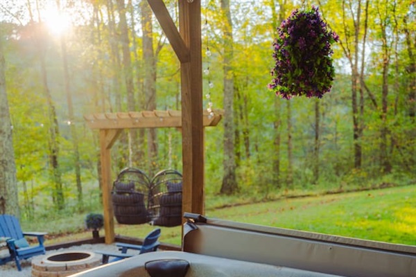 Take in the peaceful views from the porch, surrounded by nature's beauty.