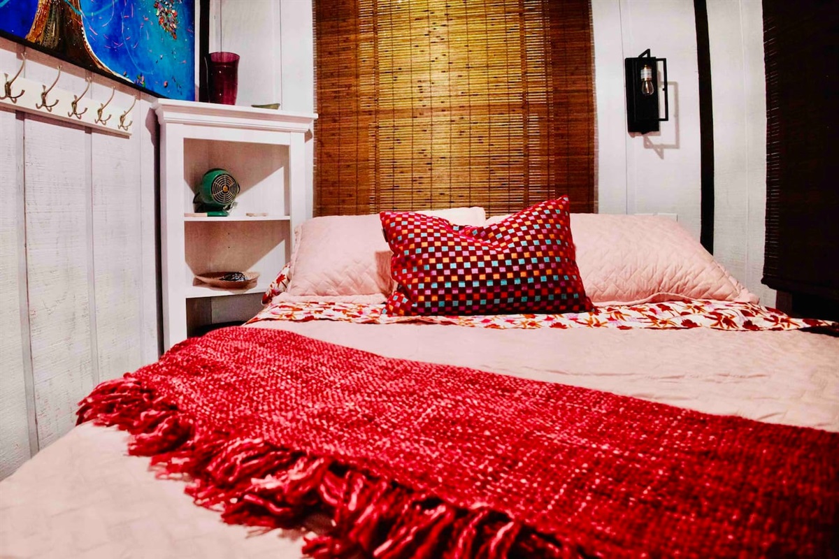 Don’t let the size of a shipping container fool you.  A queen size bed with bedside light, corner shelving, clothing hooks, books, and a bedside fan will provide you with a restful night.  
