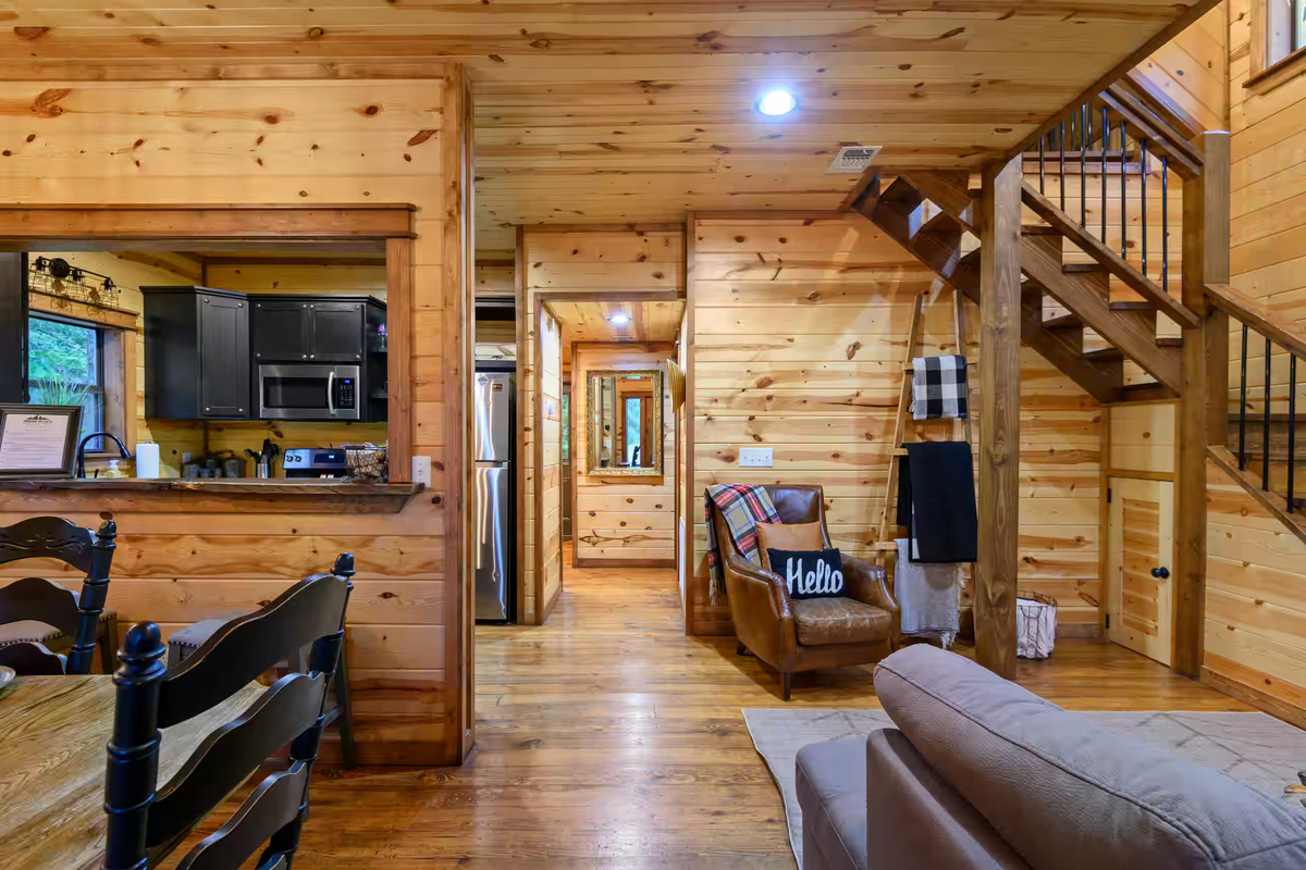 Living Room: Inviting wood accents and warm lighting create an ideal space for relaxation!