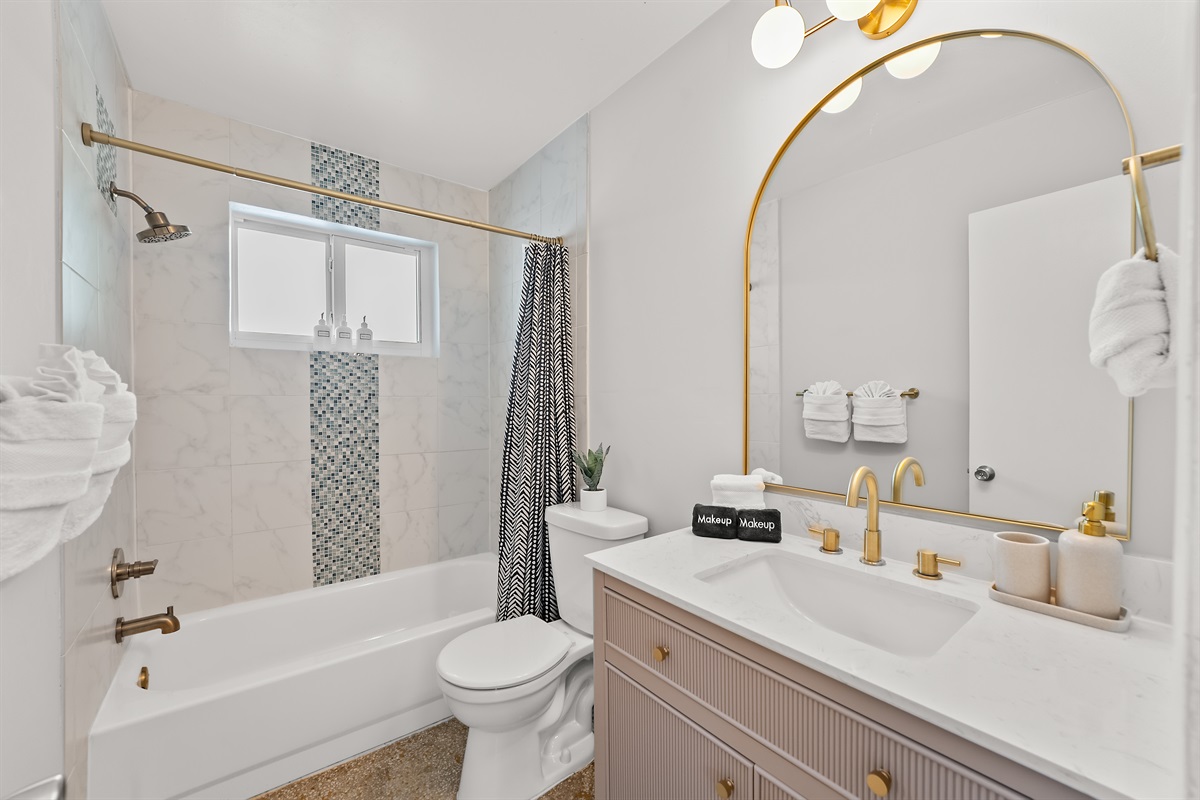 🛁 Start your mornings sparkling in this bright, glam bathroom shared by the hallways bedrooms.