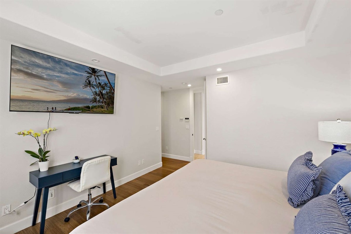 The bedroom also has a dedicated work space and a 65" TV with plenty of streaming channels for movie night or binge watching :)