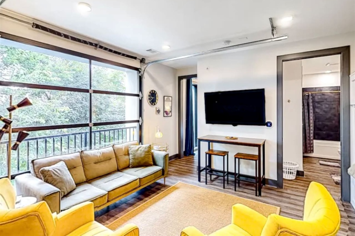 Living Room: Modern retreat with bright views, comfy seating, and a stylish dining area. Perfect for relaxation!