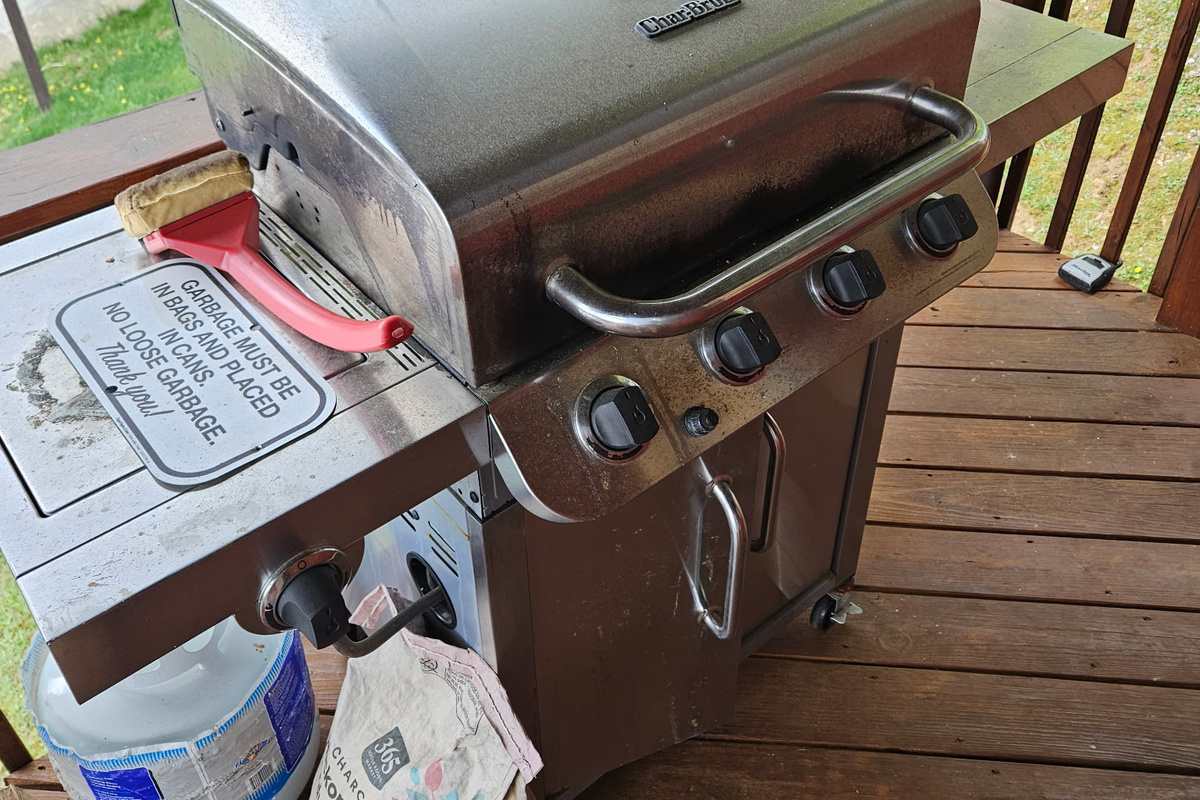 Gas grill on the deck makes outdoor meals easy without missing the mountain atmosphere.