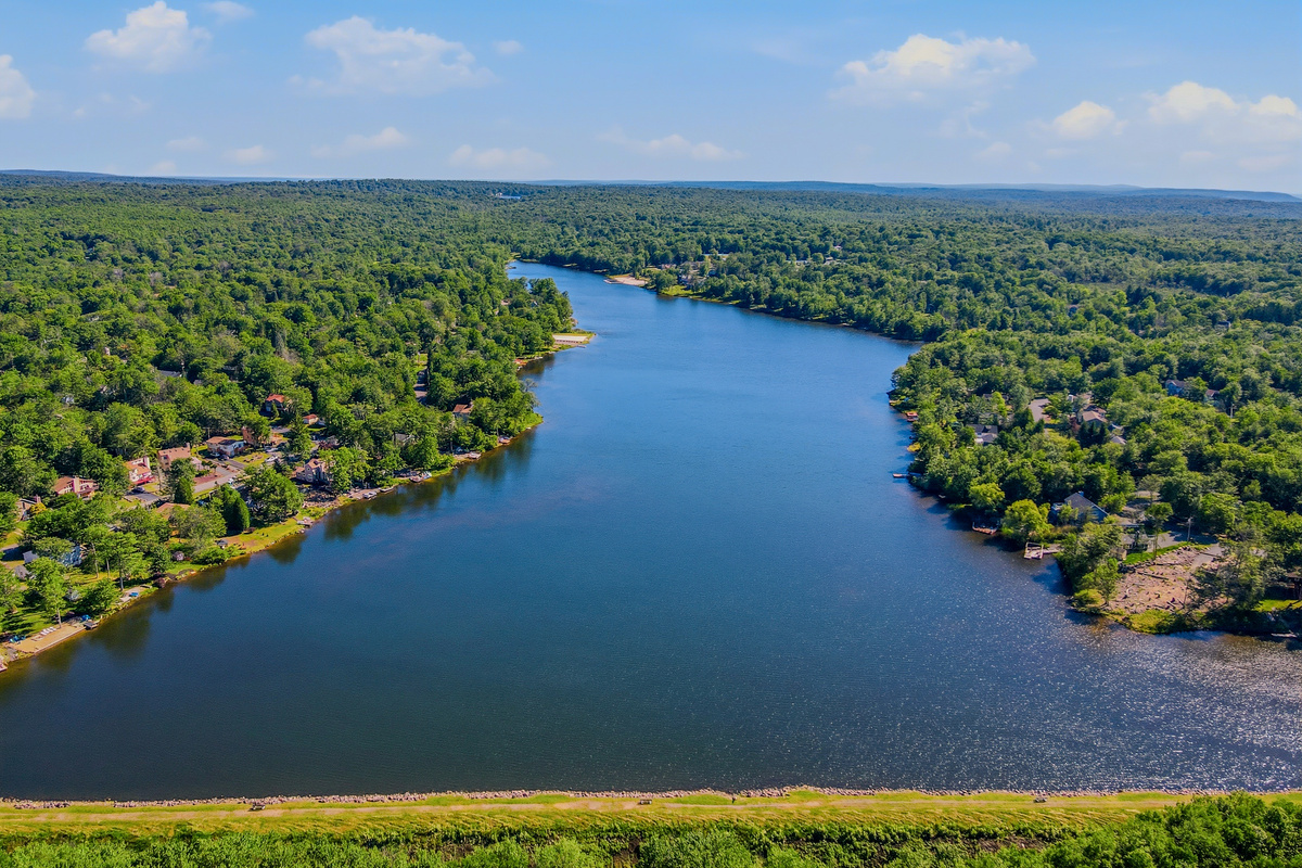 Lake Carobeth from altitude — pristine water, wooded shores, and open sky