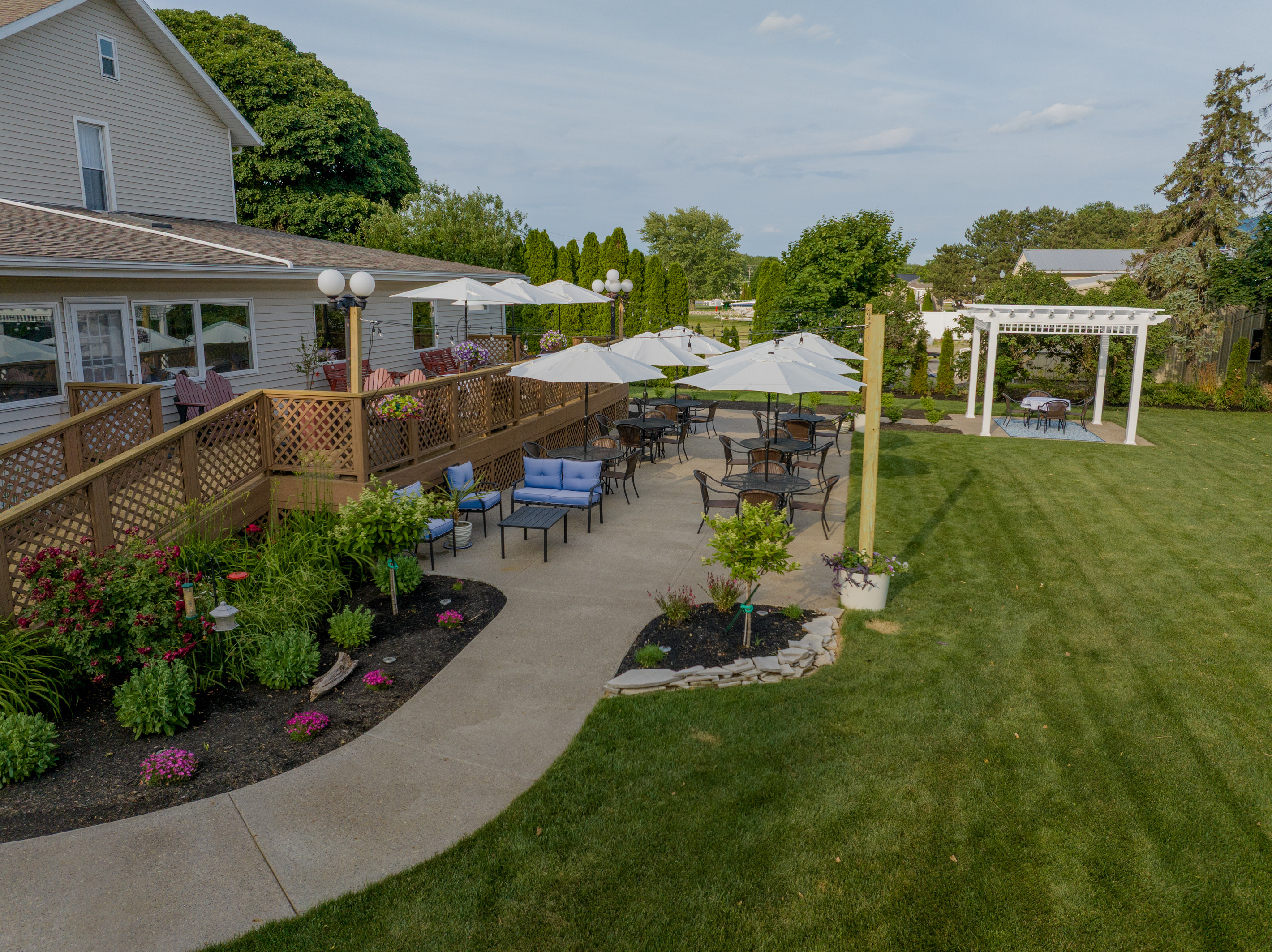 Stroll through beautifully landscaped gardens featuring roses, flowering plants, romantic seating areas, and picturesque outdoor spaces designed for relaxation