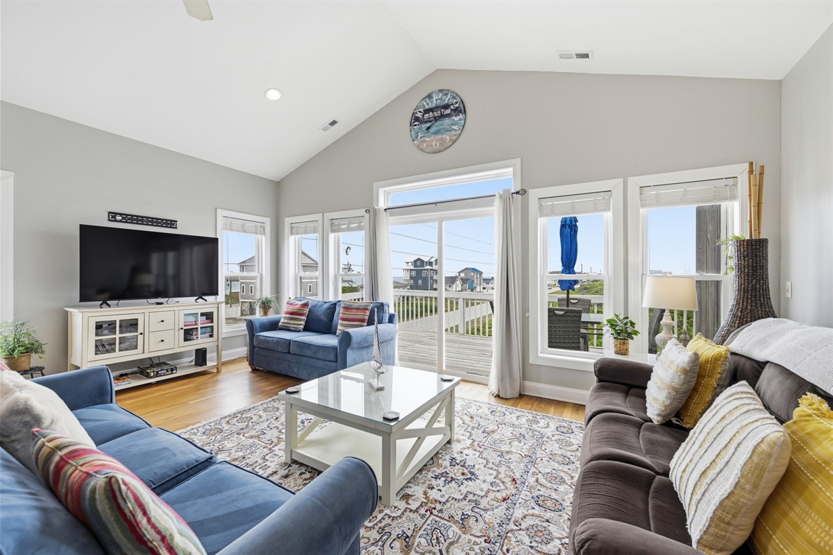 Bright, open living space with deck access and natural light throughout
