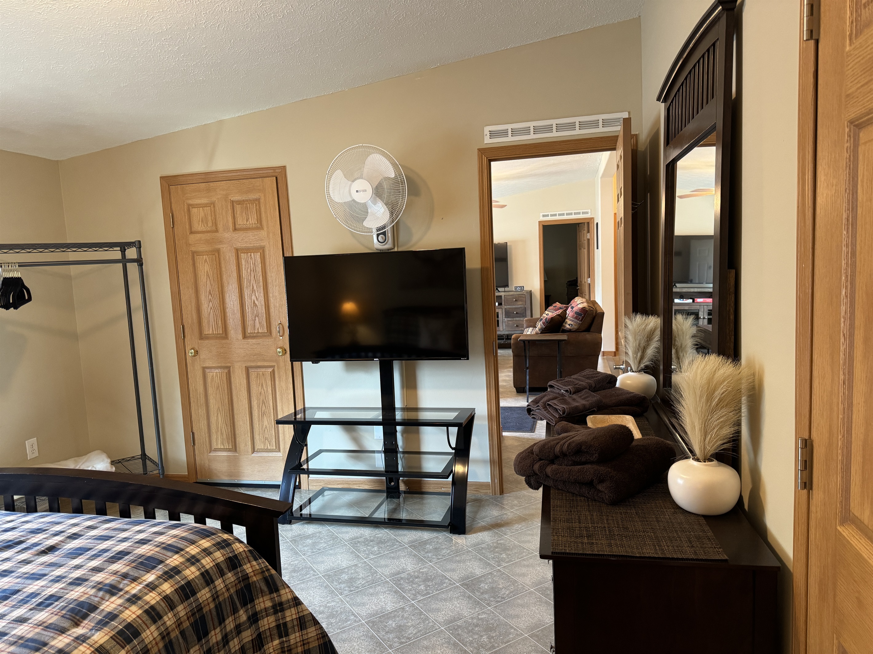 Primary queen bedroom with living room beyond