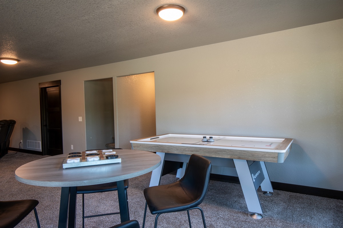 Challenge your crew to a game of air hockey or unwind with board games and snacks at the nearby table—this game room is made for fun and friendly competition.