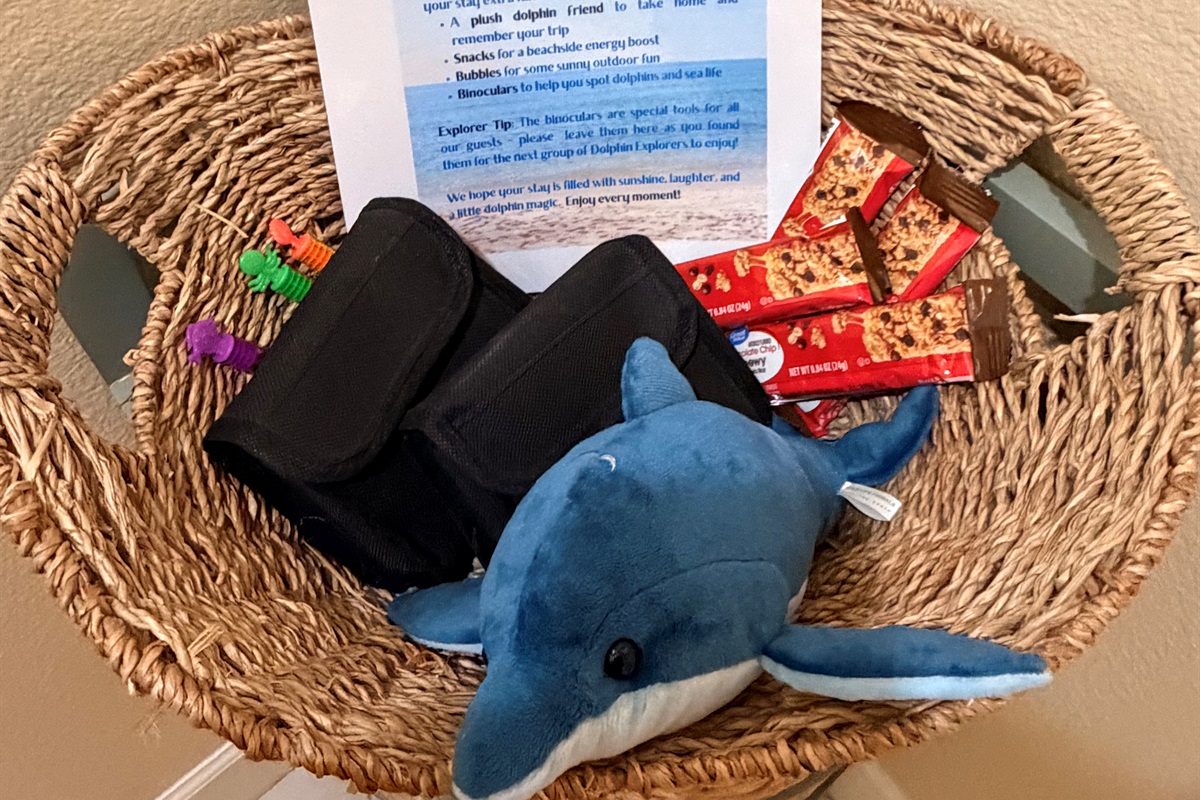 Gift basket for dolphin explorers including a plush dolphin for you to take home and remember your vacation